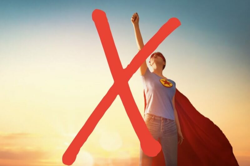 this is an image of a woman dressed as a superhero and there is a big red cross over the picture